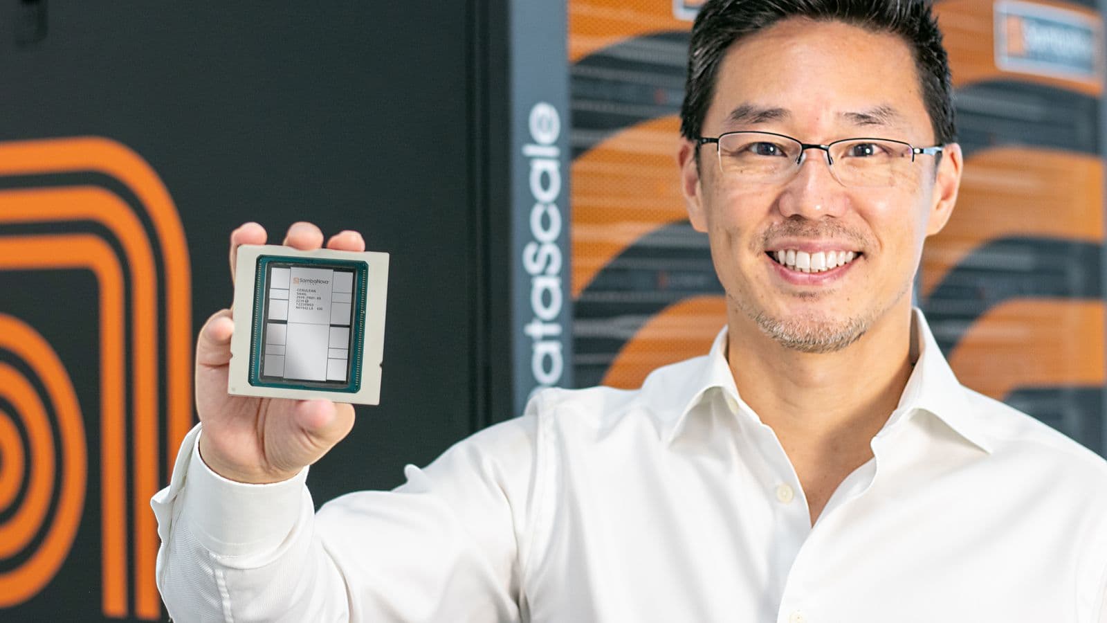 SambaNova Systems CEO Rodrigo Liang holds the SN40L Reconfigurable Dataflow Unit (RDU), the company's fourth-generation AI inference chip. SambaNova's dataflow architecture makes it one of the most likely candidates to demonstrate whether FlatAttention's collective-primitive approach generalizes beyond the unnamed hardware tested in the April 2026 paper.